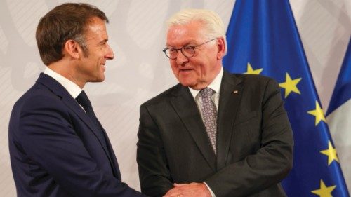epa11374999 French President Emmanuel Macron (L) and German President Frank-Walter Steinmeier react ... epa11374999 French President Emmanuel Macron (L) and German President Frank-Walter Steinmeier react ...