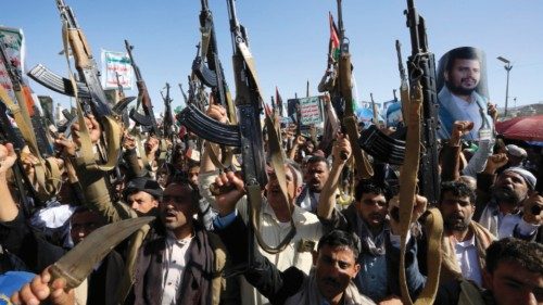 epa11396119 Houthi supporters chant slogans while holding up weapons during a protest against the US ... epa11396119 Houthi supporters chant slogans while holding up weapons during a protest against the US ...