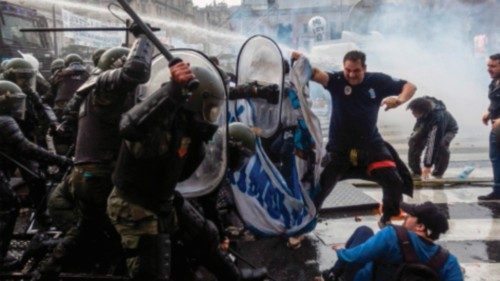 TOPSHOT - Demonstrators clash with riot police outside the National Congress in Buenos Aires on June ... TOPSHOT - Demonstrators clash with riot police outside the National Congress in Buenos Aires on June ...