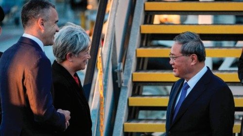 China's Premier Li Qiang (R) greets Australia's Foreign Minister Penny Wong (2nd L) and South ...