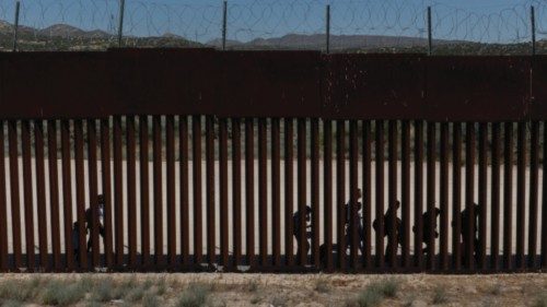 A drone view shows asylum-seeking migrants from Colombia, Peru and Panama as they walk along the ...