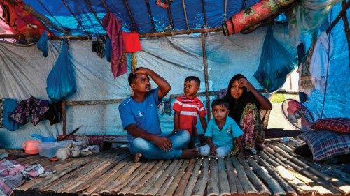In this picture taken on June 19, 2024 a family rests in their shelter for Rohingya refugees at ... In this picture taken on June 19, 2024 a family rests in their shelter for Rohingya refugees at ...