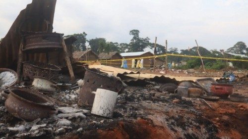 Kitchen items lie within the ruins of market stalls as volunteers search for bodies of residents ... Kitchen items lie within the ruins of market stalls as volunteers search for bodies of residents ...