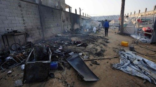 A man walks past the remains of destroyed tents the day after a strike on the al-Mawasi area, ... A man walks past the remains of destroyed tents the day after a strike on the al-Mawasi area, ...