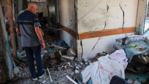 Palestinians inspect the rubble at the al-Daraj clinic in Gaza City after it was hit in an Israeli ... Palestinians inspect the rubble at the al-Daraj clinic in Gaza City after it was hit in an Israeli ...