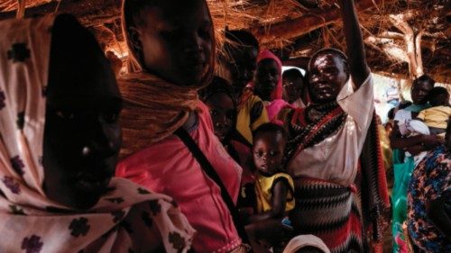 TOPSHOT - Mothers wait at a malnutrition centre to register for food aid for their children in the ... TOPSHOT - Mothers wait at a malnutrition centre to register for food aid for their children in the ...