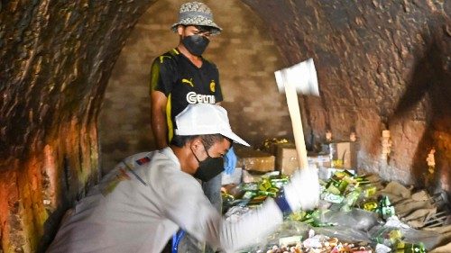 Officials and workers prepare to burn seized drugs
during a ceremony to mark the UN's 'International ...