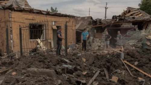 Residents clean debris next to heavily damaged houses following shelling in Pokrovsk,eastern Donetsk ... Residents clean debris next to heavily damaged houses following shelling in Pokrovsk,eastern Donetsk ...