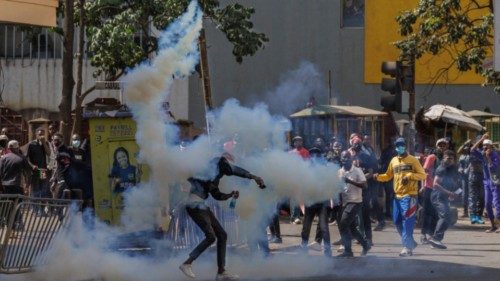 A protester thorws back a teargas canister at police during a nationwide strike to protest against ... A protester thorws back a teargas canister at police during a nationwide strike to protest against ...