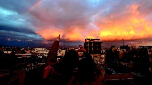 A picture taken from Rafah shows children pointing towards a rainbow over the southern Gaza Strip on ... A picture taken from Rafah shows children pointing towards a rainbow over the southern Gaza Strip on ...