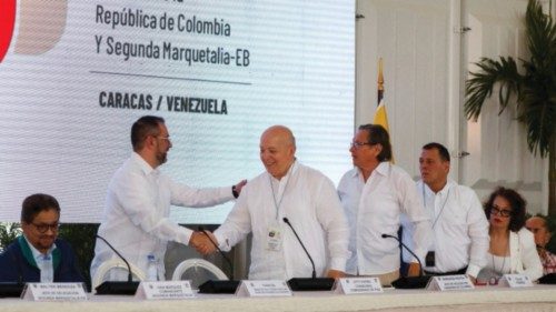 Otty Patino, Peace Commissioner Counselor, shake hands with Yvan Gil, Venezuela's Foreign Minister ...