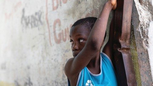 A child looks on following the arrival of the first contingent of Kenyan police as part of a ... A child looks on following the arrival of the first contingent of Kenyan police as part of a ...