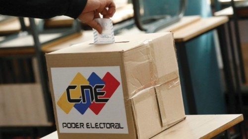 A man casts his vote in an electoral simulation before the upcoming Venezuela presidential election ... A man casts his vote in an electoral simulation before the upcoming Venezuela presidential election ...