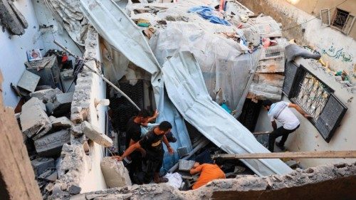 Palestinians asses the damage following an Israeli strike in the Nuseirat refugee camp in the ... Palestinians asses the damage following an Israeli strike in the Nuseirat refugee camp in the ...