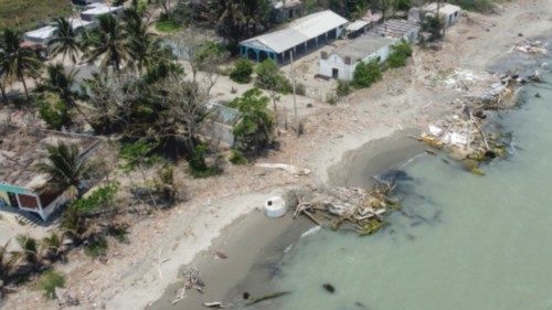 Aerial view showing destroyed houses by rising sea levels and coastal erosion associated with ... Aerial view showing destroyed houses by rising sea levels and coastal erosion associated with ...