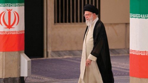 Iran's supreme leader Ayatollah Ali Khamenei arrives to cast his ballot during the runoff of the ...
