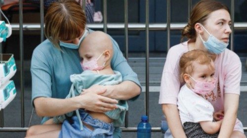 Women hold patients at Ohmatdyt Children's Hospital that was damaged during Russian missile strikes, ... Women hold patients at Ohmatdyt Children's Hospital that was damaged during Russian missile strikes, ...