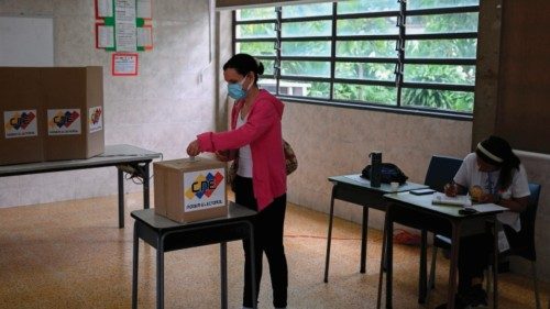 A woman votes at a polling station during a mock election in Caracas on June 30, 2024. Venezuela ... A woman votes at a polling station during a mock election in Caracas on June 30, 2024. Venezuela ...