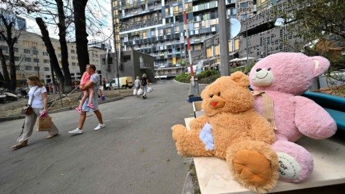 A man carries his daughter in Okhmatdyt, the biggest children's hospital in Ukraine, in Kyiv on July ... A man carries his daughter in Okhmatdyt, the biggest children's hospital in Ukraine, in Kyiv on July ...