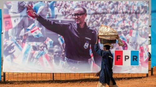 A man walks past an electoral billboard depicting the incumbent President of Rwanda and the ruling ... A man walks past an electoral billboard depicting the incumbent President of Rwanda and the ruling ...
