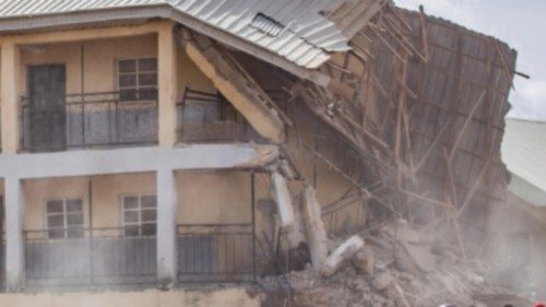 epaselect epa11474926 People gather at the site of a collapsed building at Saint Academy school in ... epaselect epa11474926 People gather at the site of a collapsed building at Saint Academy school in ...