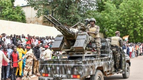 A vehicle of the Presidential Guard of Niger passes in front of the Niamey conference center where ... A vehicle of the Presidential Guard of Niger passes in front of the Niamey conference center where ...