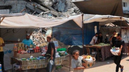 People shop for basic necessities at a makeshift market in Nuseirat in the central Gaza Strip on ... People shop for basic necessities at a makeshift market in Nuseirat in the central Gaza Strip on ...