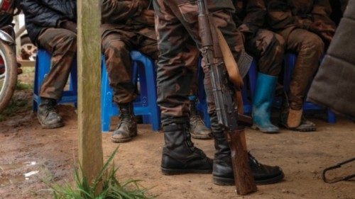 A soldier holds a weapon as soldiers of the Democratic Republic of Congo Army attend their trial in ... A soldier holds a weapon as soldiers of the Democratic Republic of Congo Army attend their trial in ...