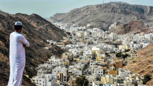 (FILES) A man stands atop a hill in al-Wadi al-Kabir west of Oman's capital Muscat on February 14, ... (FILES) A man stands atop a hill in al-Wadi al-Kabir west of Oman's capital Muscat on February 14, ...