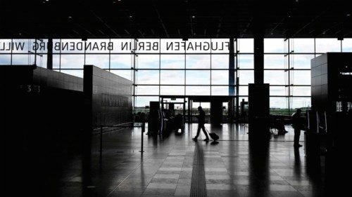 (FILES) A passenger walks through the almost empty main terminal of the BER Berlin Brandenburg ... (FILES) A passenger walks through the almost empty main terminal of the BER Berlin Brandenburg ...