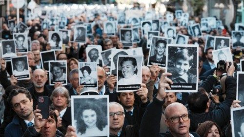 People hold images of the victims of the 1994 bombing attack on the Argentine Israeli Mutual ... People hold images of the victims of the 1994 bombing attack on the Argentine Israeli Mutual ...