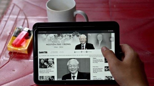 A person reads news reporting on the death of Nguyen Phu Trong, the general secretary of the ... A person reads news reporting on the death of Nguyen Phu Trong, the general secretary of the ...