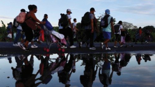 Migrants of different nationalities walk towards the U.S. in a caravan along a road, in Ciudad ... Migrants of different nationalities walk towards the U.S. in a caravan along a road, in Ciudad ...