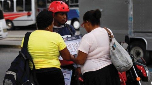 People look at a flyer of the electoral ballot for the Presidential elections of July 28, in ... People look at a flyer of the electoral ballot for the Presidential elections of July 28, in ...