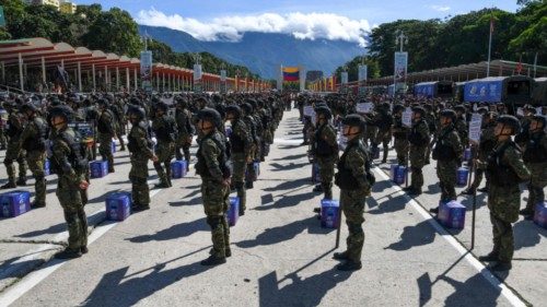 TOPSHOT - Army soldiers stand next to ballot boxes as they participate in a military parade ... TOPSHOT - Army soldiers stand next to ballot boxes as they participate in a military parade ...