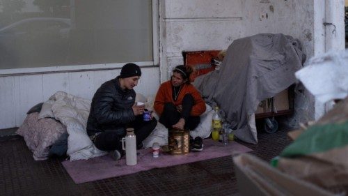 A homeless couple drink mate in a street in Buenos Aires on July 10, 2024. After the first three ... A homeless couple drink mate in a street in Buenos Aires on July 10, 2024. After the first three ...