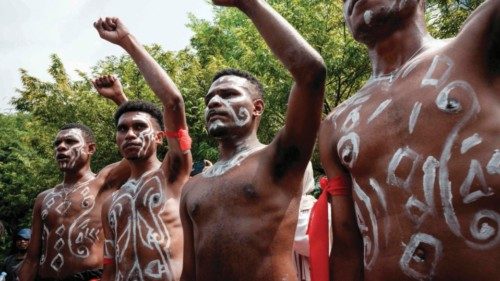 University students gesture during a protest as representatives from communities of the Awyu tribe ... University students gesture during a protest as representatives from communities of the Awyu tribe ...