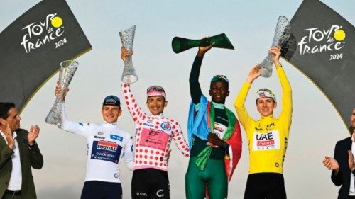 TOPSHOT - Overall winner UAE Team Emirates team's Slovenian rider Tadej Pogacar wearing the overall ... TOPSHOT - Overall winner UAE Team Emirates team's Slovenian rider Tadej Pogacar wearing the overall ...