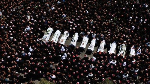 People gather during the funeral of children who were killed at a soccer pitch by a rocket Israel ... People gather during the funeral of children who were killed at a soccer pitch by a rocket Israel ...