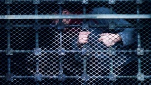 Inmates hang on to bars behind windows of a wing as they stage a protest at the San Vittore prison ... Inmates hang on to bars behind windows of a wing as they stage a protest at the San Vittore prison ...