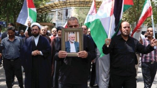 epa11510983 Iranians carry the portrait of late Hamas political leader Ismail Haniyeh and ... epa11510983 Iranians carry the portrait of late Hamas political leader Ismail Haniyeh and ...