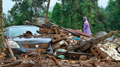 A man walks past a damaged vehicle after the landslides in Wayanad on August 1, 2024. Indian rescue ... A man walks past a damaged vehicle after the landslides in Wayanad on August 1, 2024. Indian rescue ...