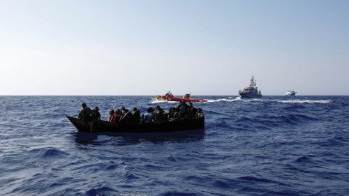 Migrants on a small iron boat await rescue by the Geo Barents migrant rescue ship, operated by ...