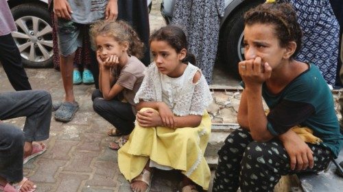 Children mourn Palestinian Ismail Nofal, who was killed in an Israeli strike on a tent camp for ... Children mourn Palestinian Ismail Nofal, who was killed in an Israeli strike on a tent camp for ...