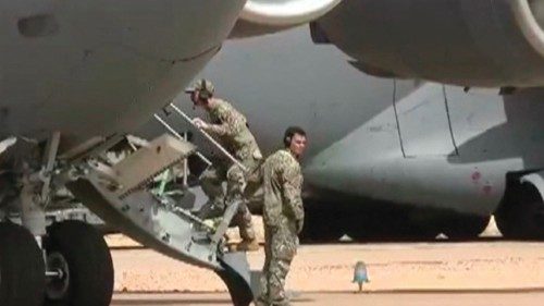 This screenshot picture taken from video shows US military personnel boarding a US Military cargo ... This screenshot picture taken from video shows US military personnel boarding a US Military cargo ...