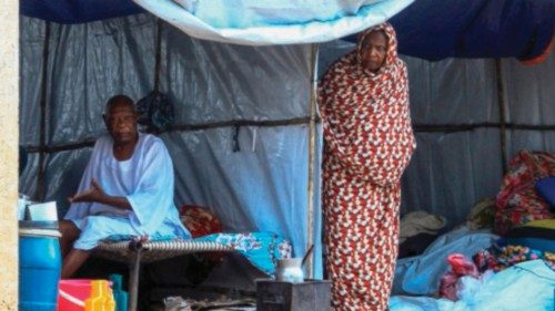 People already displaced by conflict, rest in tents at a makeshift campsite they were evacuated to ... People already displaced by conflict, rest in tents at a makeshift campsite they were evacuated to ...