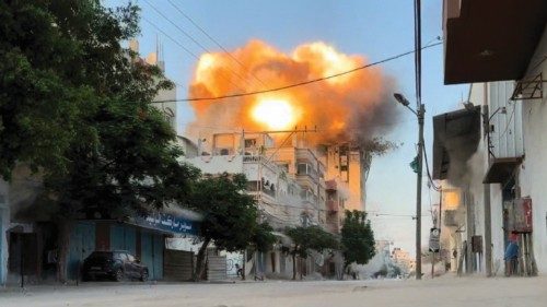 Smoke and flames rise following an Israeli strike on a residential building, amid the ongoing ... Smoke and flames rise following an Israeli strike on a residential building, amid the ongoing ...
