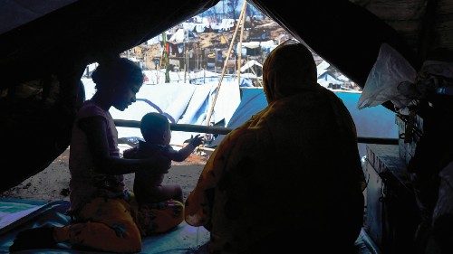 A Rohingya refugee family rests in a temporary shelter days after a fire burnt their home at a ... A Rohingya refugee family rests in a temporary shelter days after a fire burnt their home at a ...