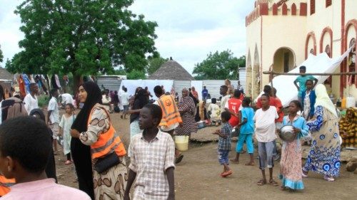 Sudanese, displaced from the town of Sinjah, receive humanitarian aid at their makeshift camp in the ... Sudanese, displaced from the town of Sinjah, receive humanitarian aid at their makeshift camp in the ...