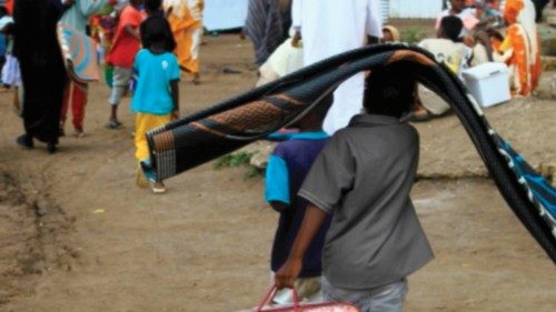 Sudanese, displaced from the town of Sinjah, receive humanitarian aid at their makeshift camp in the ... Sudanese, displaced from the town of Sinjah, receive humanitarian aid at their makeshift camp in the ...